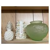 Green vase, thermometer, pineapple
