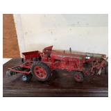 McCormick Farmall toy tractor, implements