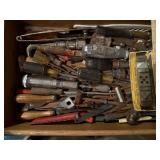 Contents of tool drawer, screwdrivers, putty