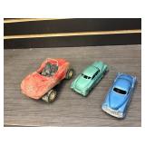 Three metal toy cars