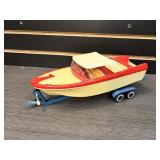 Plastic boat with metal trailer