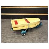 Pair of plastic boats with metal trailer