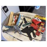 Caulk gun, putty knives, paint roller, level,