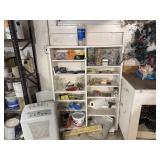 Storage shelves of tools, hardware, adhesives,