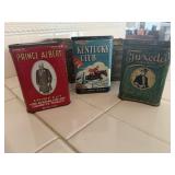 Basket of tobacco tins, tie clip