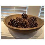 Wooden bowl of pinecones