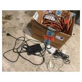 Box of power cords, surge protectors