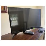 Samsung 32" television, remote controls