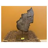 Metal face sculpture