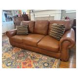 Leather sofa, throw pillows