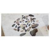 Native American arrows, pieces, tools