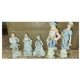 figurines, one has broken neck