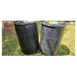 two plastic barrels