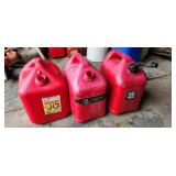 three gas cans, only one has spout