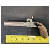 antique muzzle loading pistol, display only