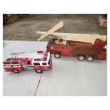 two toy fire trucks, one broken as shown