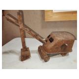 toy steam shovel, has been burned