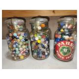3 glass top jars with vtg marbles
