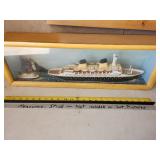 wooden ship in shadow box