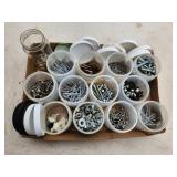 small hardware in plastic jars