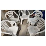 four resin chairs
