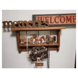 WElcome and memories sign, shelf and contents