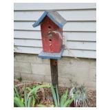 birdhouse on metal stand