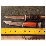two unmarked hunting knives
