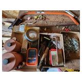 saw, hardware, contents of boxes on workbench