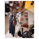 golf clubs and bag/supplies
