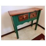 geeen table with drawers
