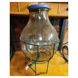 glass liquid dispensor on stand