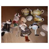 dolls, shells, tea set