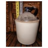 jug, bottom has crack