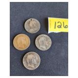 four turn of the century British pennies