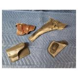 4 assorted hand gun holsters