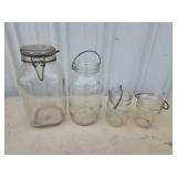 4 assorted glass jars with bales