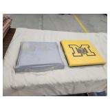 Two assorted vinyl foam bleacher cushions Two assorted vinyl foam bleacher cushions