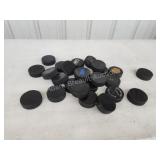 Large assortment hockey pucks Large assortment hockey pucks