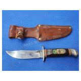Bushmaster 702 Whitetail embossed 9-in stainless Bushmaster 702 Whitetail embossed 9-in stainless