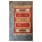 Small oriental floor rug