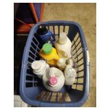 Laundry basket with assorted laundry soap and