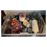 Tote of assorted candles and holders