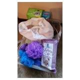 Tote of new bathroom supplies- soap toothpaste,