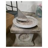 Decorative concrete bird bath with metal sailboat