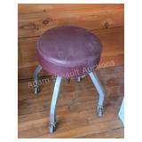 Vintage Rolling Shop Stool. Round maroon vinyl