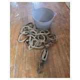GRAY PLASTIC BUCKET WITH ROPE AND WOODEN BLOCK