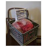 GRAY PLASTIC MILK CRATE WITH RED TERRY TOWELS AND