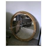 Vintage ornate gold framed oval mirror