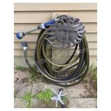 Decorative Sun hose hanger with hose and Gilmore